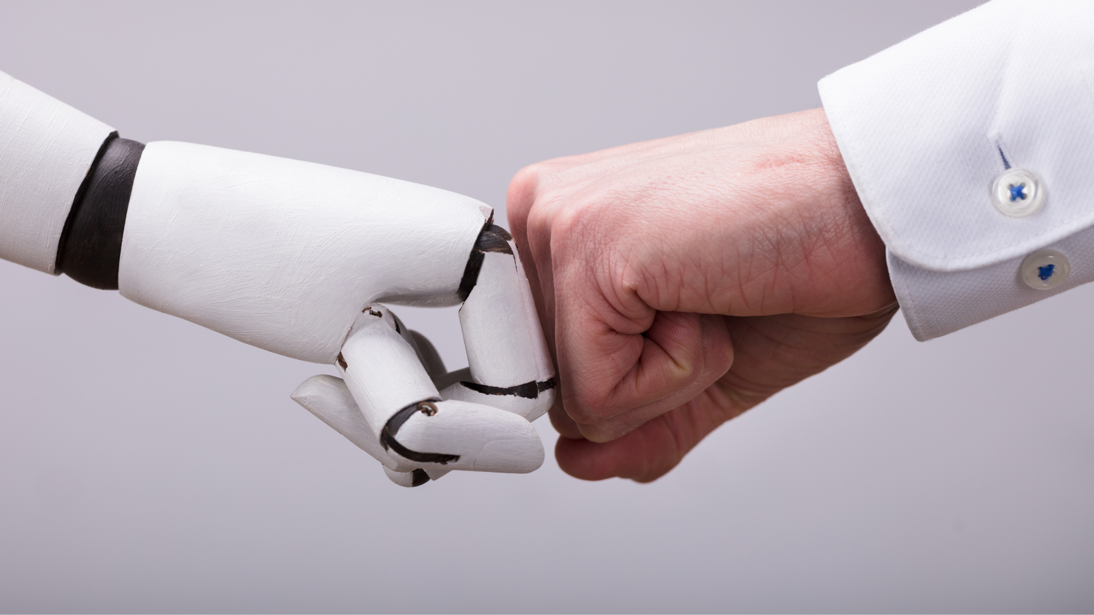 robot hand knuckles human hand