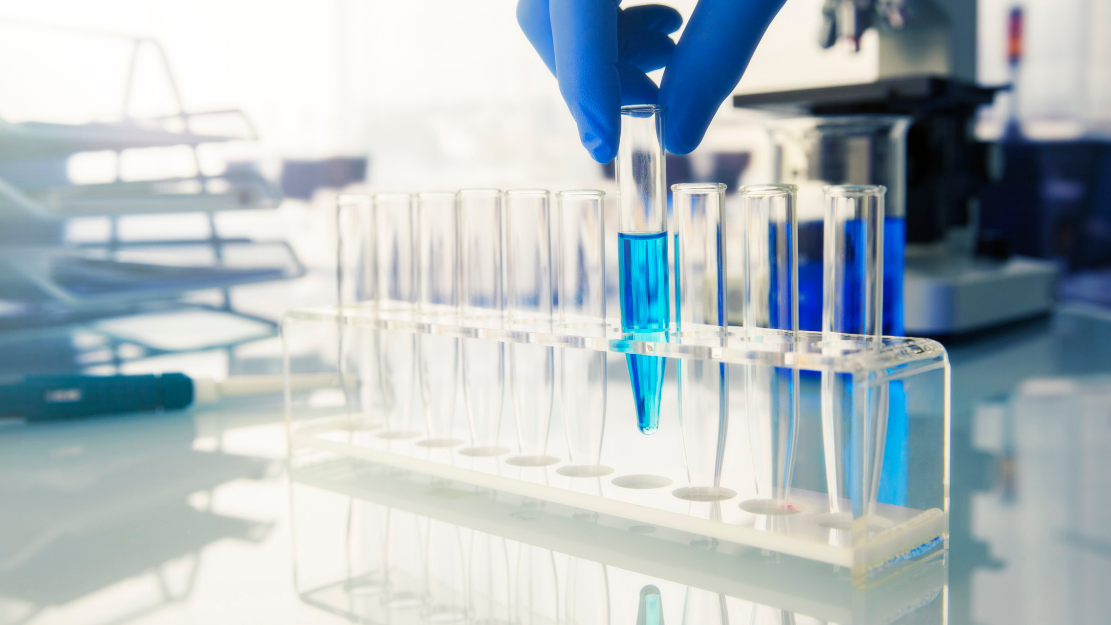 lab vials with blue liquid